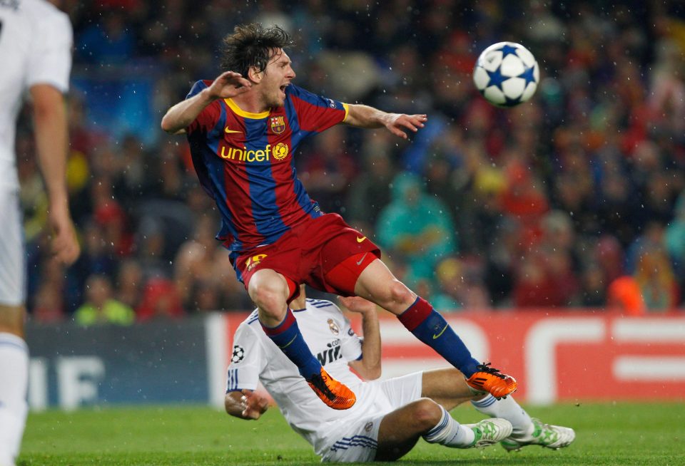  Lionel Messi is often the recipient of strong challenges from Real Madrid