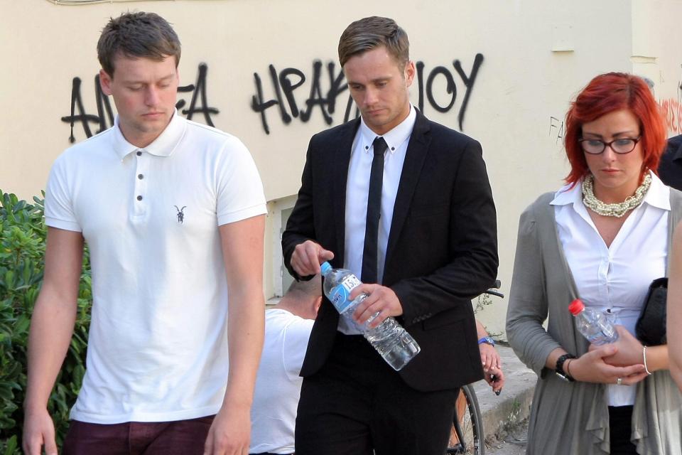  Luke Walker, centre, with family members walk out of the courtroom during his trial in 2012, which was postponed