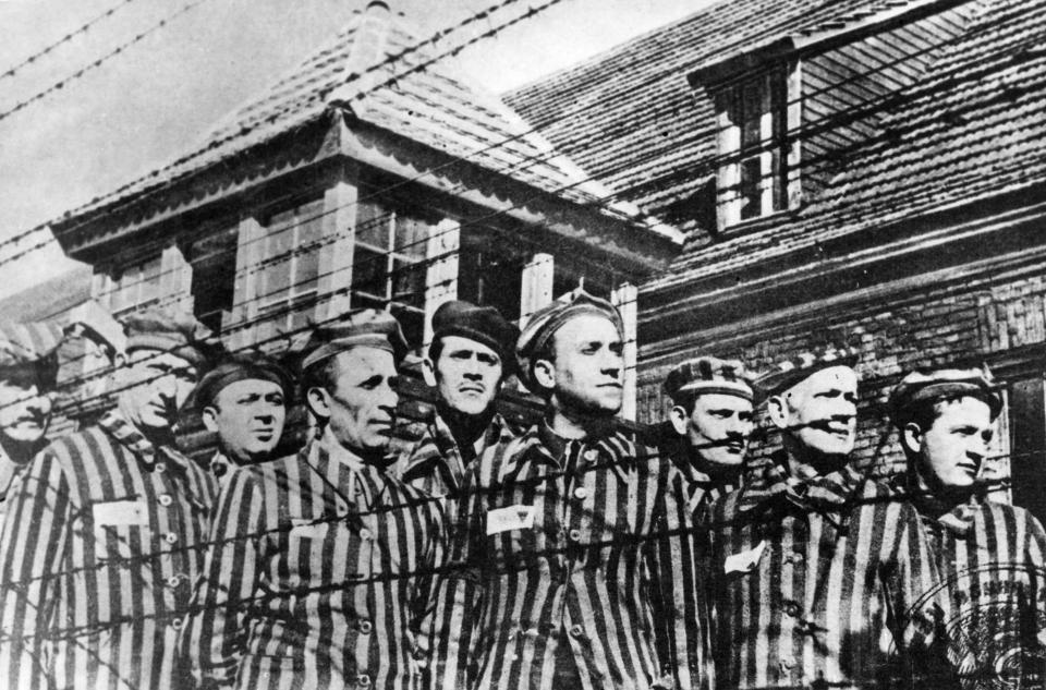  Survivors art Auschwitz concentration camp in 1945. The genocide claimed the lives of an estimated six million Jewish people