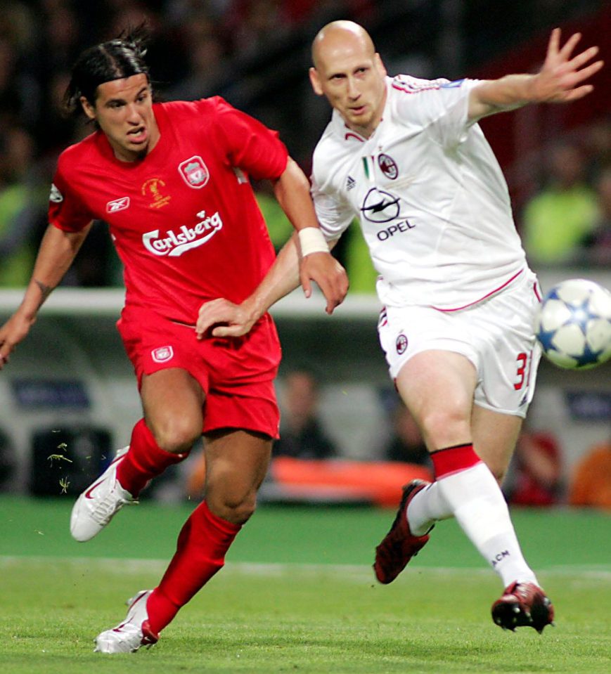 Stam in action against Milan Baros of Liverpool