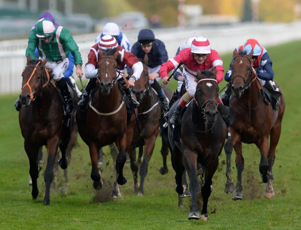  Rivet ridden by Andrea Atzeni (right, pink silks) wins the Racing Post Trophy during the Racing Post Trophy Day at Doncaster Racecourse