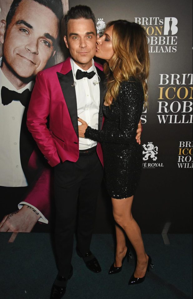  Let me entertain you . . . Robbie Williams poses with his wife Ayda Field