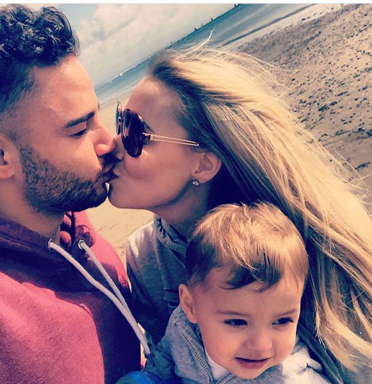  Stunning Caroline puckers up to fiance Adam during a getaway with son Teddy