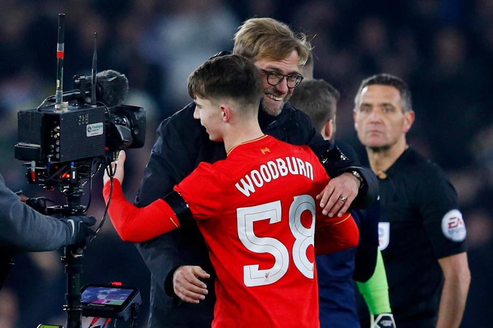 Jurgen Klopp gives Ben Woodburn a hug after the Liverpool youngster scores on his full debut