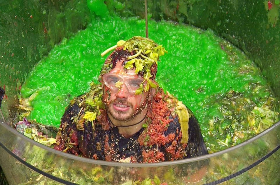  Adam looks annoyed as he stands in a vat full of gunge for a Bushtucker Trial