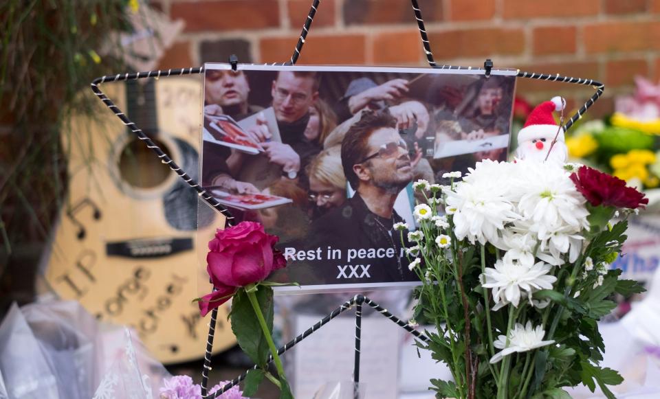 Floral tributes outside the Goring home of pop superstar George Michael