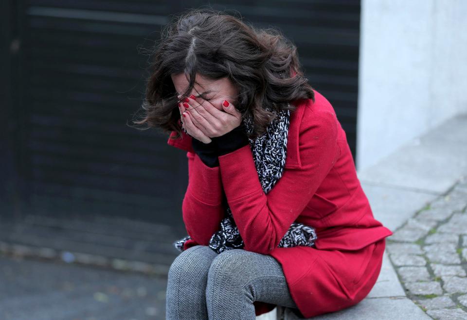  A woman mourns outside the nightclub