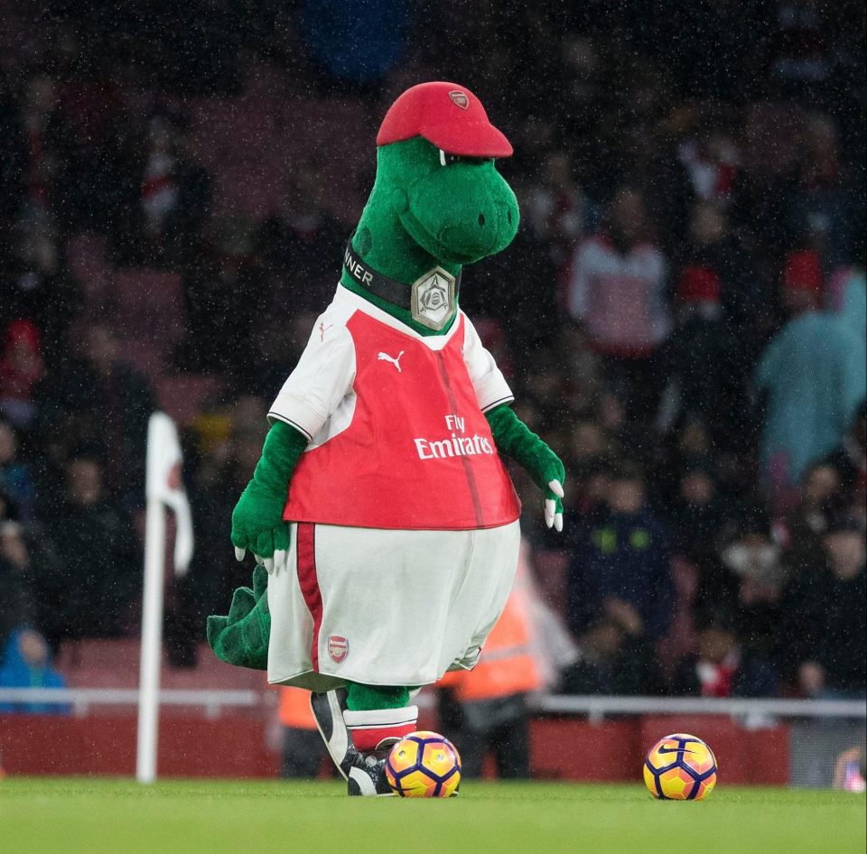  Arsenal mascot Gunnersaurus knows how to find a hat that fits