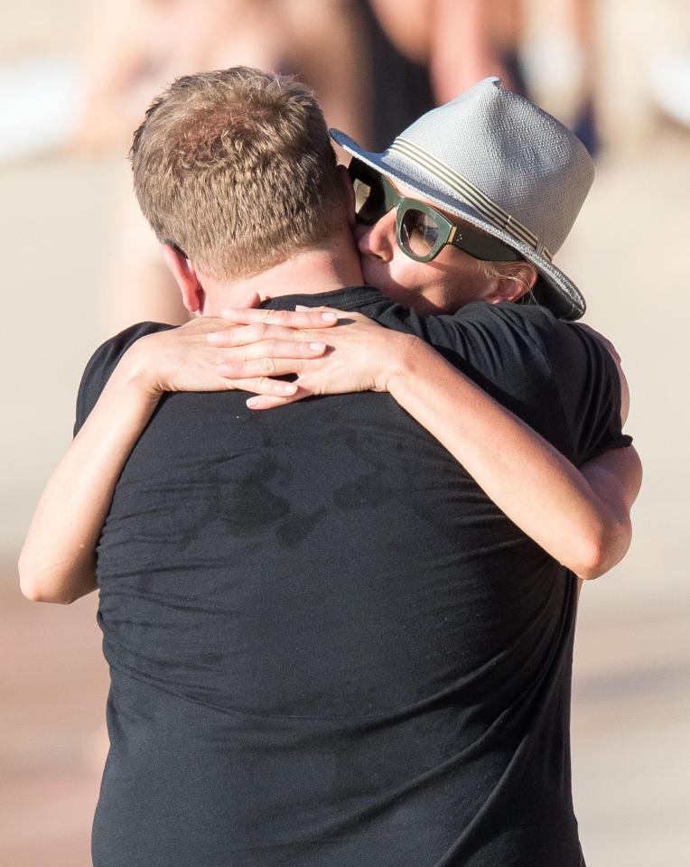  The pair wrapped their arms around each other as they enjoyed the sunshine