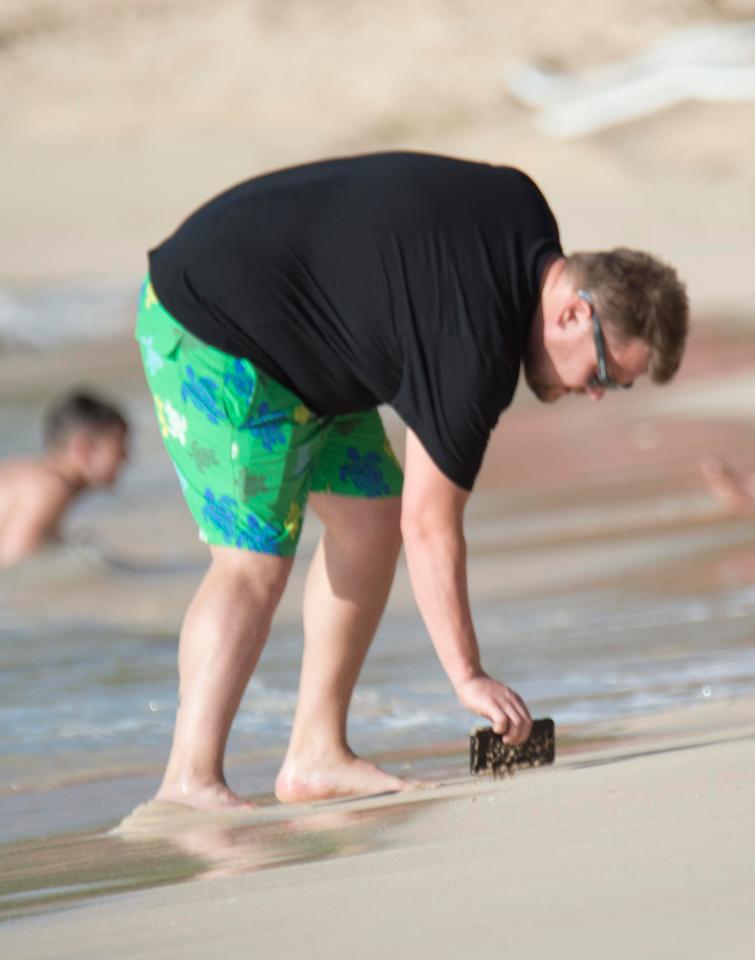  Then James Corden accidentally drops his phone in the wet sand