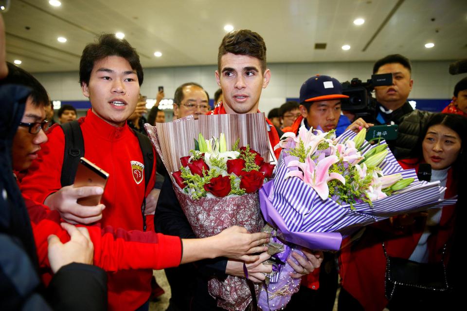  Oscar was swarmed by supporters as he finally arrived following £60m move