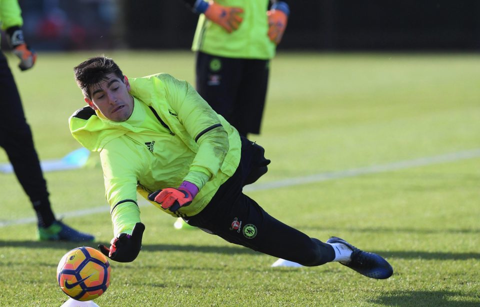  Courtois dives to push the ball away in goalkeeping drill