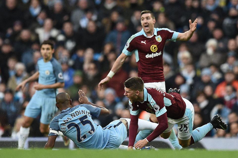  The Burnley man feeling the full force of the tackle