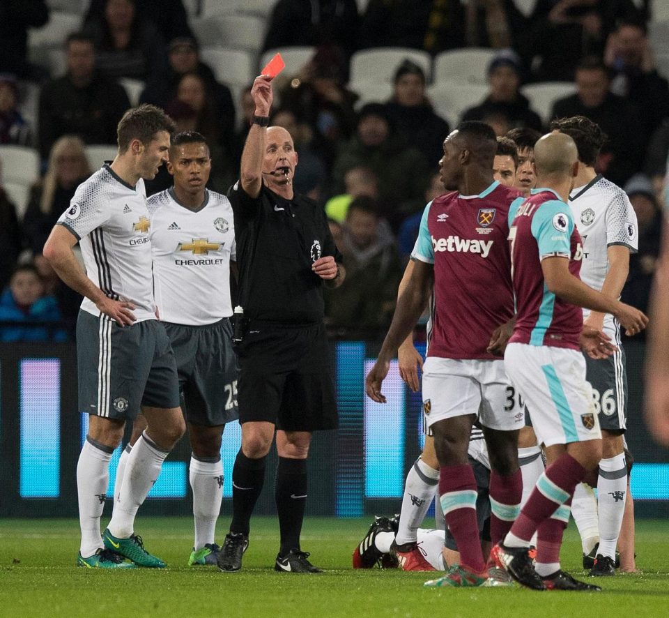  Mike Dean controversially sent off Sofiane Feghouli for a late tackle on Phil Jones