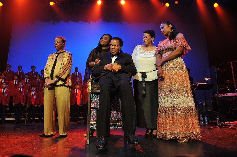  Boxing legend Ali with wife Lonnie, left, and daughter Hana, right