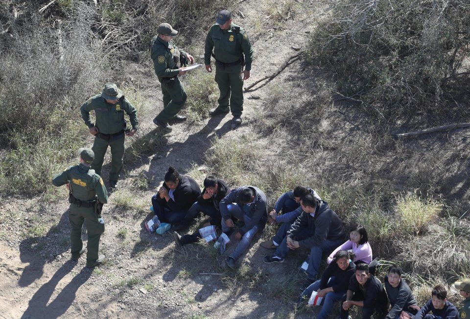  Border agents watch over immigrants who crossed the US-Mexico border near McAllen, Texas