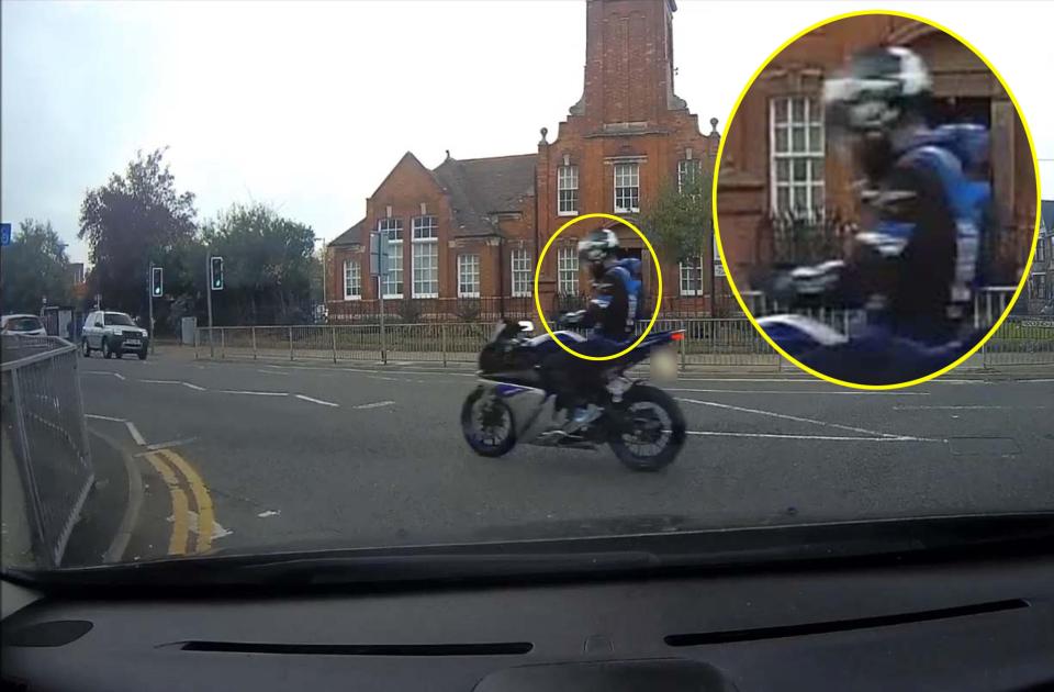  A foolish motorcyclist was caught taking both hands off the bike to text