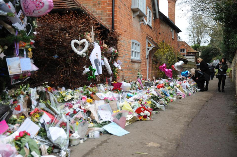  Tribues have been laid for George outside the home in Oxfordshire where his body was found