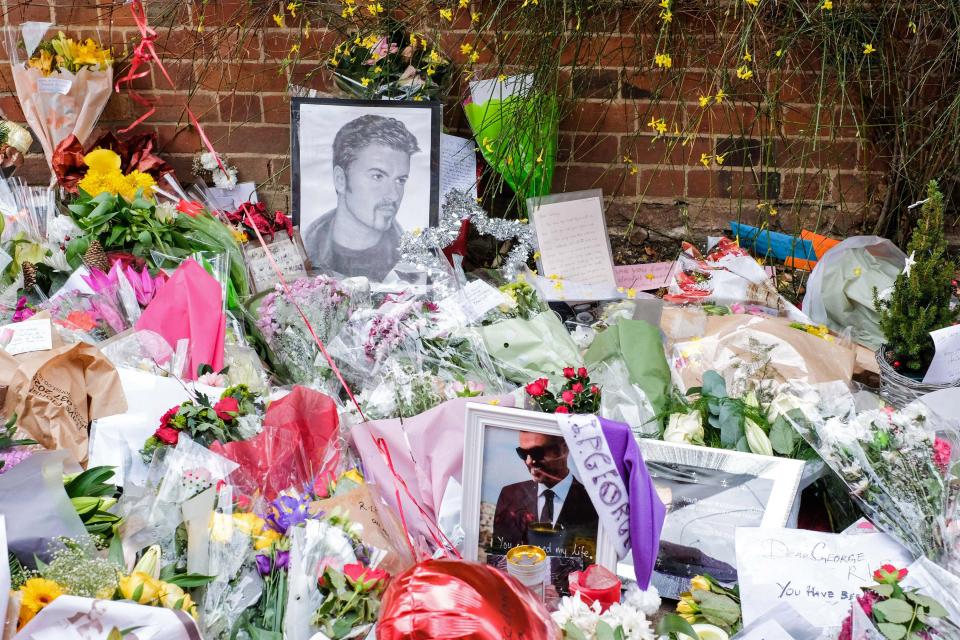  Dozens of floral tributes were left outside George Michael's Oxfordshire home after his death