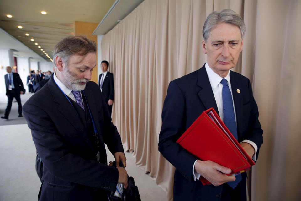  Sir Tim (pictured on left with Chancellor Philip Hammond) previously worked as a diplomat in Moscow