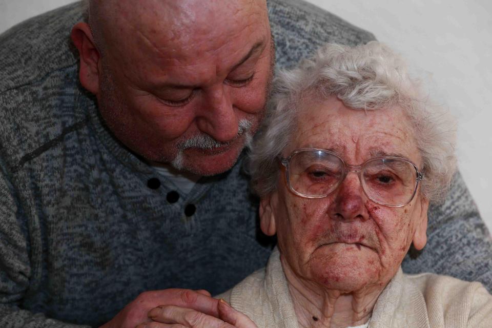  Jean, with son Steve, was dragged around her home by the heartless burglar