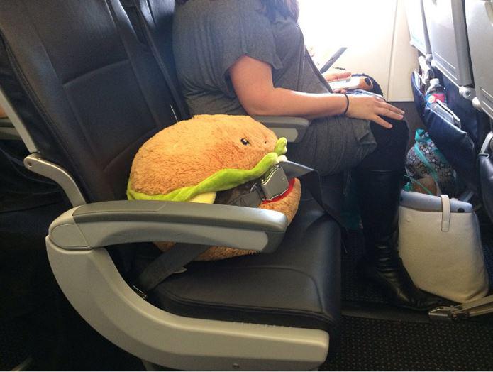  One passenger paid for the in-flight WiFi immediately so he could share this image of a burger who has been strapped in its own seat