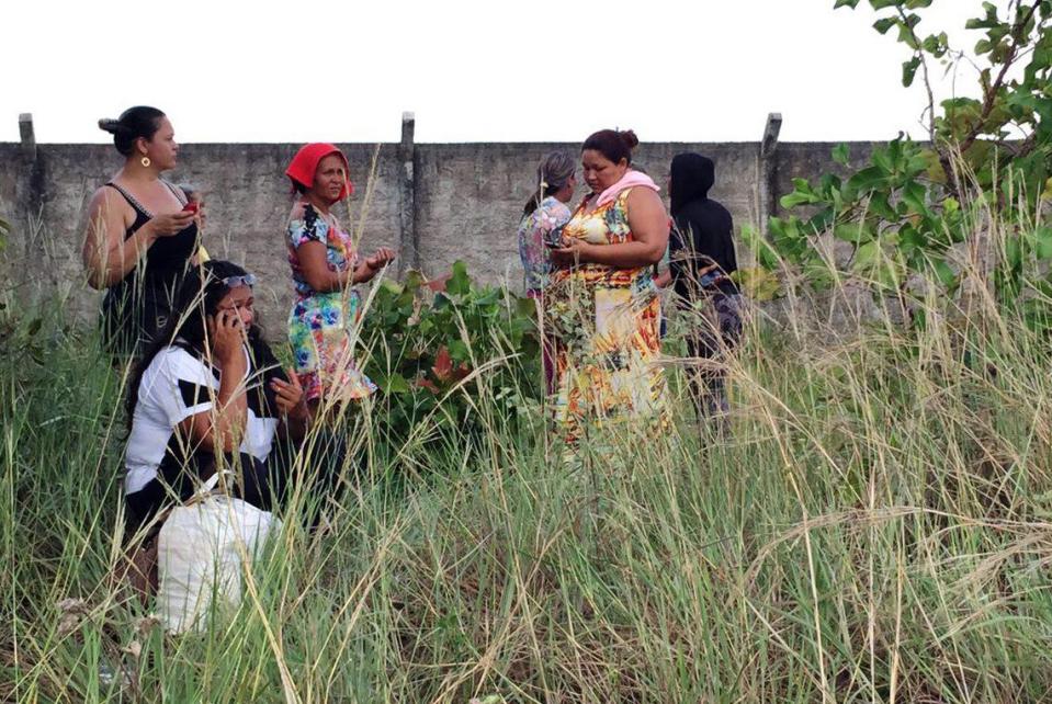 Worried relatives of inmates wait for information outisde the Monte Cristo prison