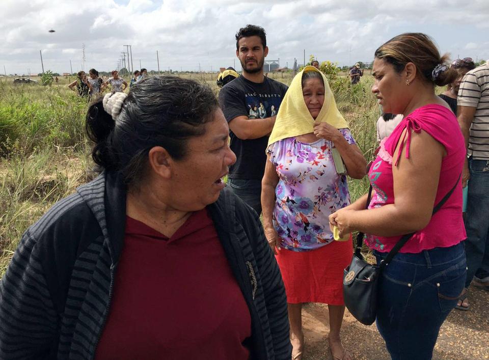 The relatives were seen comforting each other as they waited for news