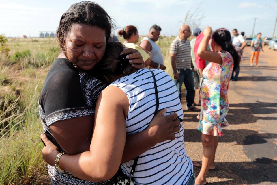  Hysterical relatives pictured waiting for news after the prison riots