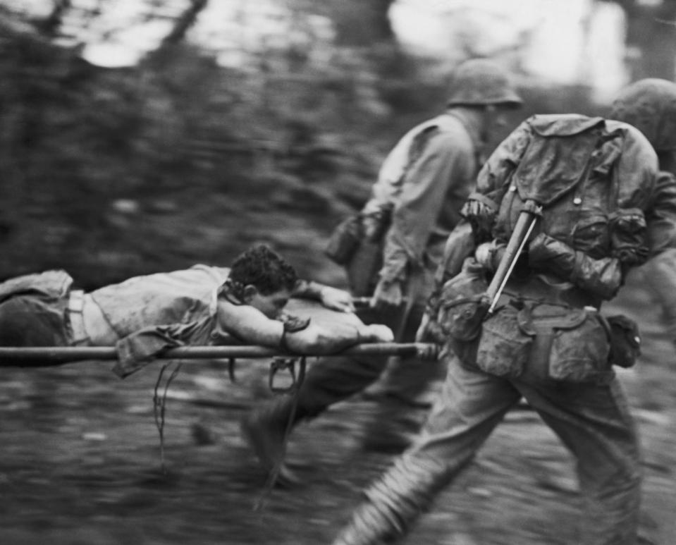 an injured US Marine from a battlefield in the south of Okinawa Island