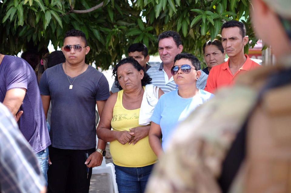  Families wait anxiously for news about their inmate relatives following Friday's massacre