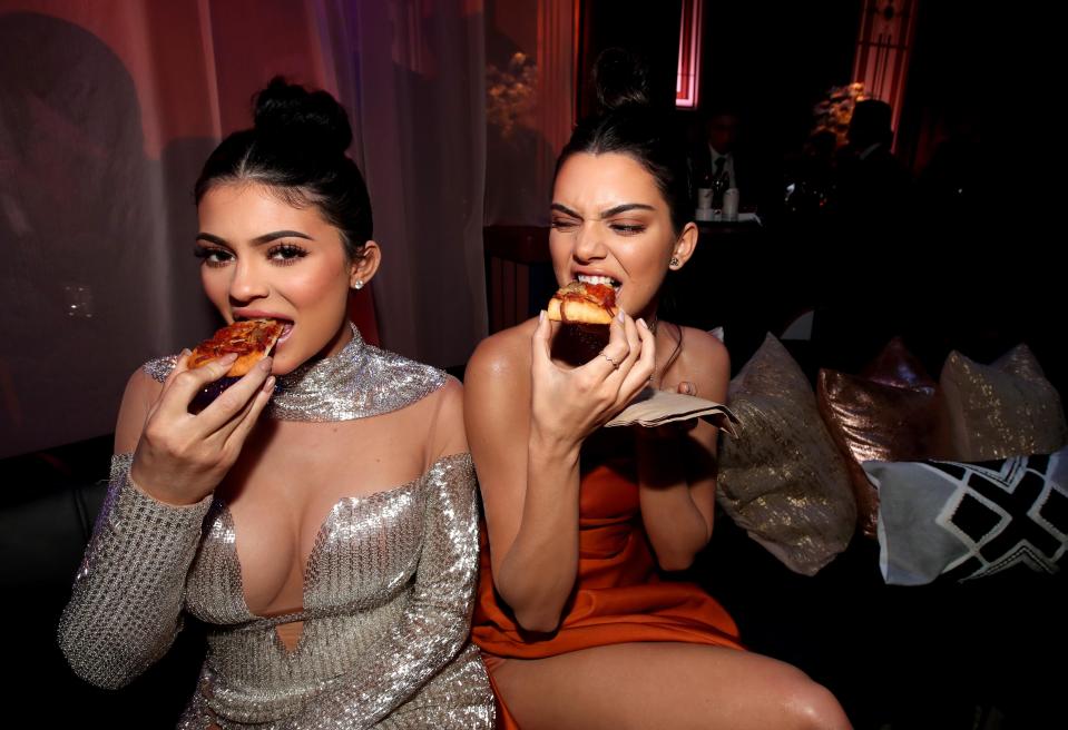  Kylie and Kendall Jenner wolfed down pizza as they partied together