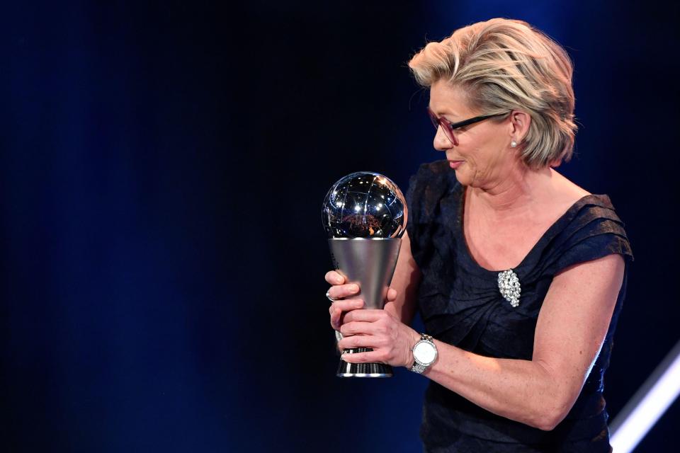  Silvia Neid shows off her trophy after being named the best Fifa Women's coach