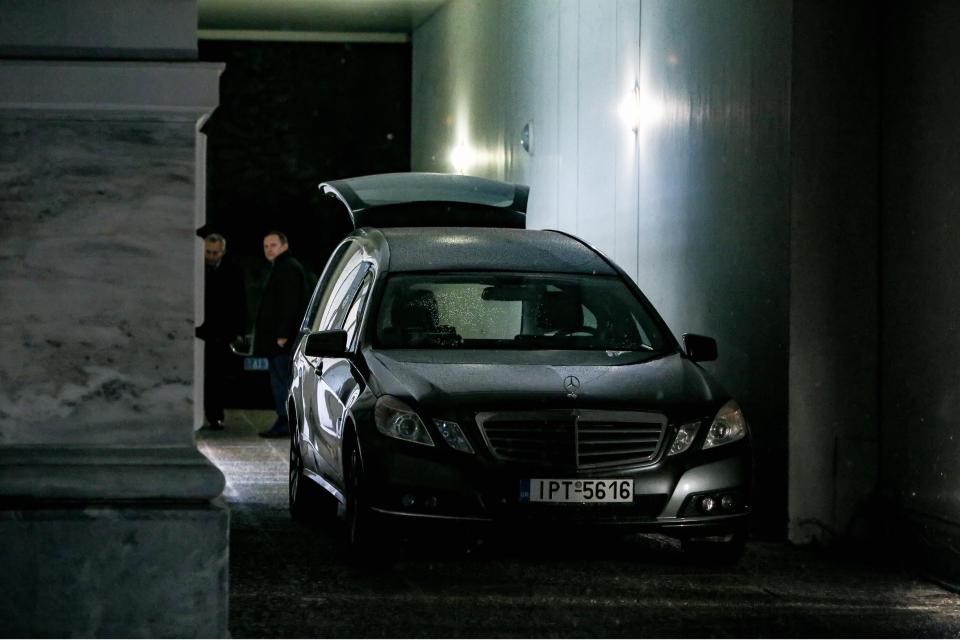  A hearse carries away the body of a top Russian diplomat after he was found dead at his Athens flat tonight