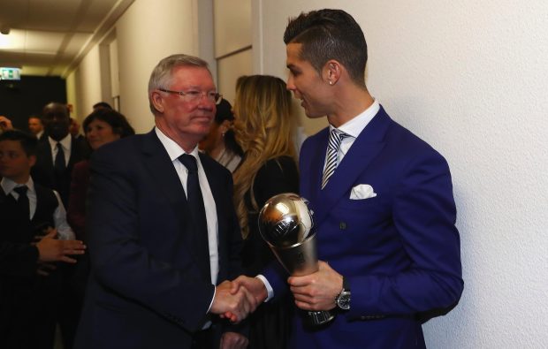 Sir Alex Ferguson shakes the hand of Cristiano Ronaldo after the latter won his best player award last night