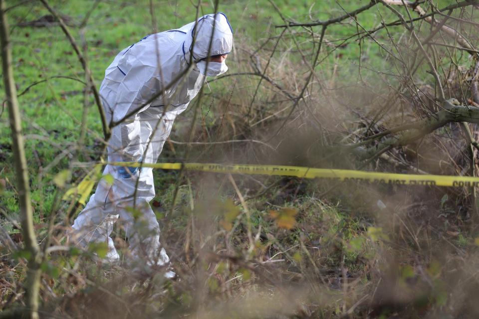  Forensics officers searched the field where Katie was found fatally injured