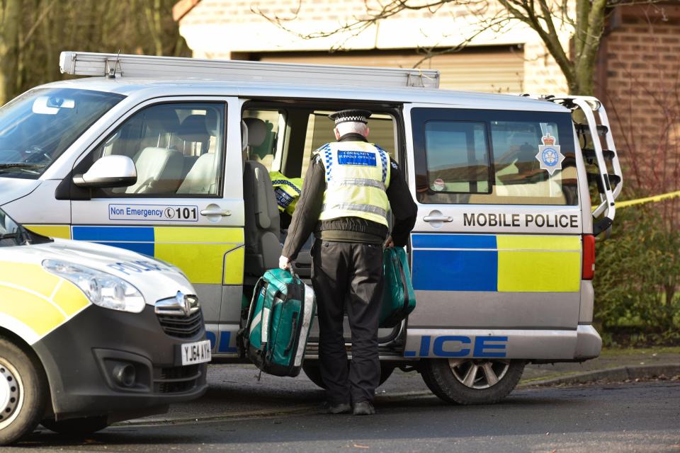  Police remove medical items and evidence from the scene near York