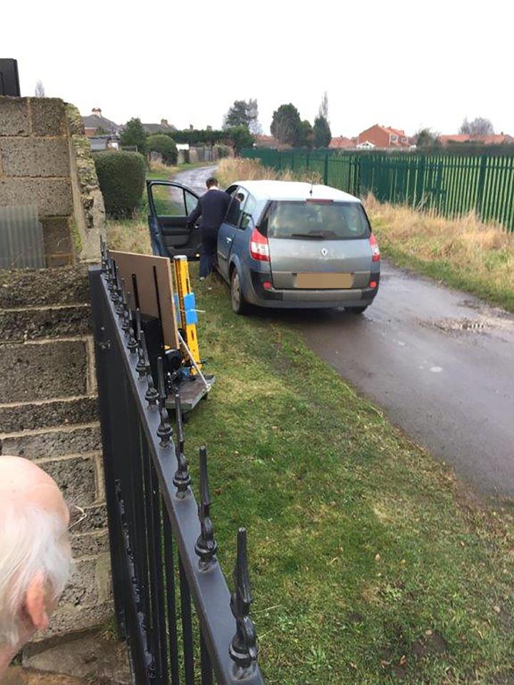  The would-be thief jumps in his Renault before driving off