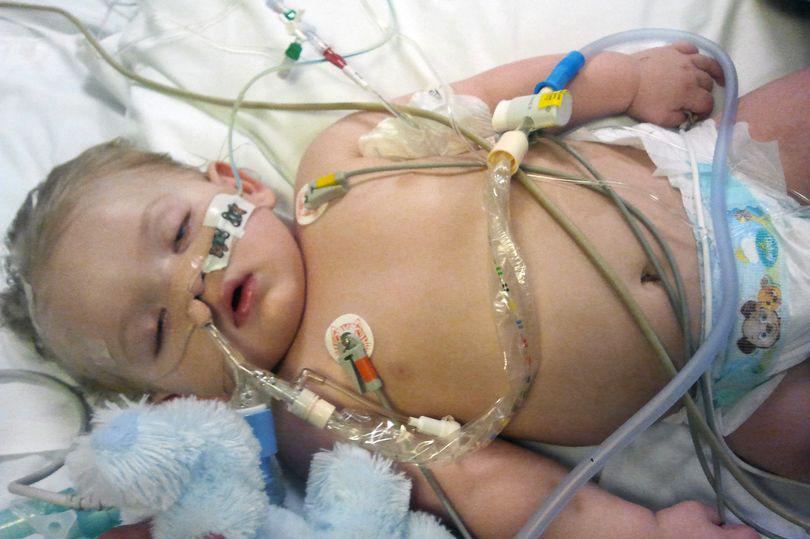 This is the harrowing final image of little Cayden, lying lifeless and hooked up to life support machines