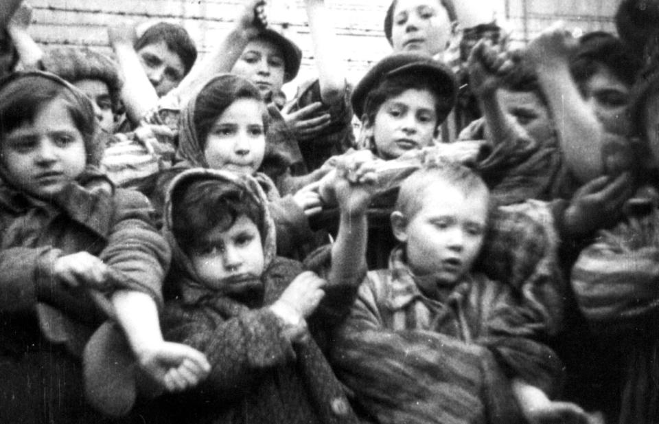  These are some of the 600 young children who managed to survive Auschwitz displaying the tattooed identification numbers on their arms