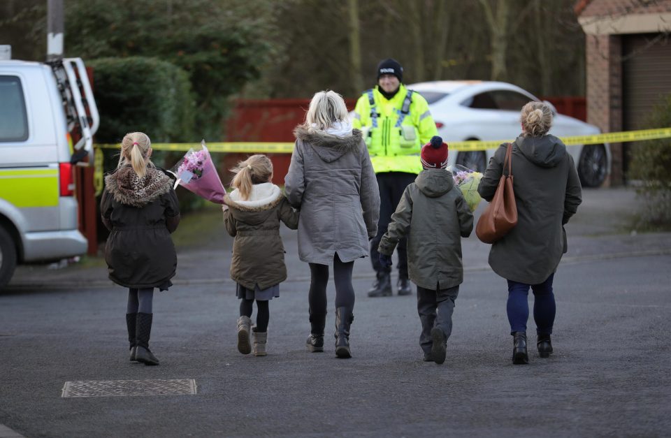  Heartbreaking pictures showed Katie's friends laying flowers where she was found