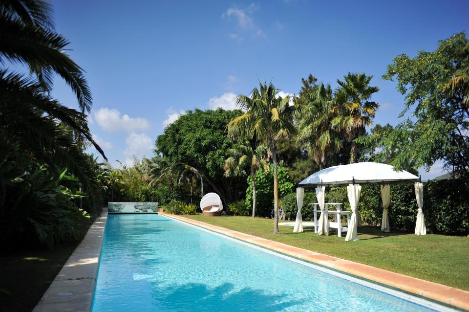  An Olympic-sized swimming pool is one of two the mansion boasts