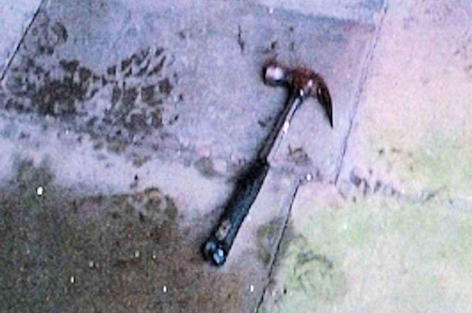 The hammer used to attack the officers lies on the floor after Piruz's arrest 