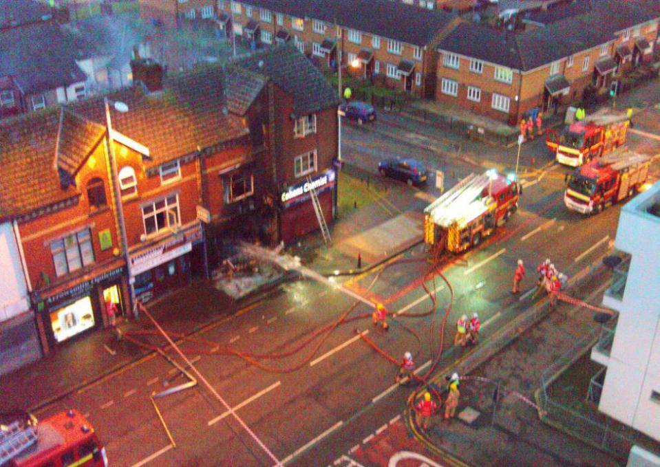  An aerial view taken several hours after the blaze showing how it has devastated the premises in Rochdale Road, Manchester