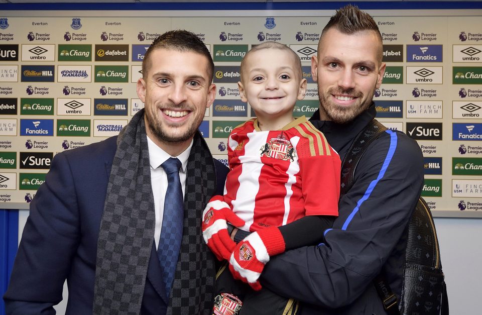  New signing Morgan Schneiderlin holds Bradley alongside club captain Phil Jagielka