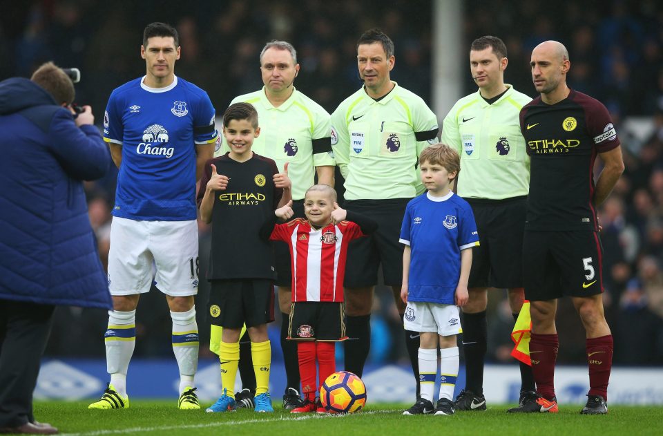  He appeared in the pre-match photo with both captains and officials