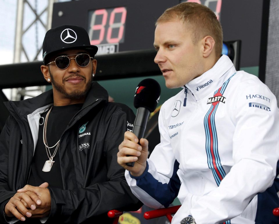  Lewis Hamilton watches new teammate Valleteri Bottas face the media