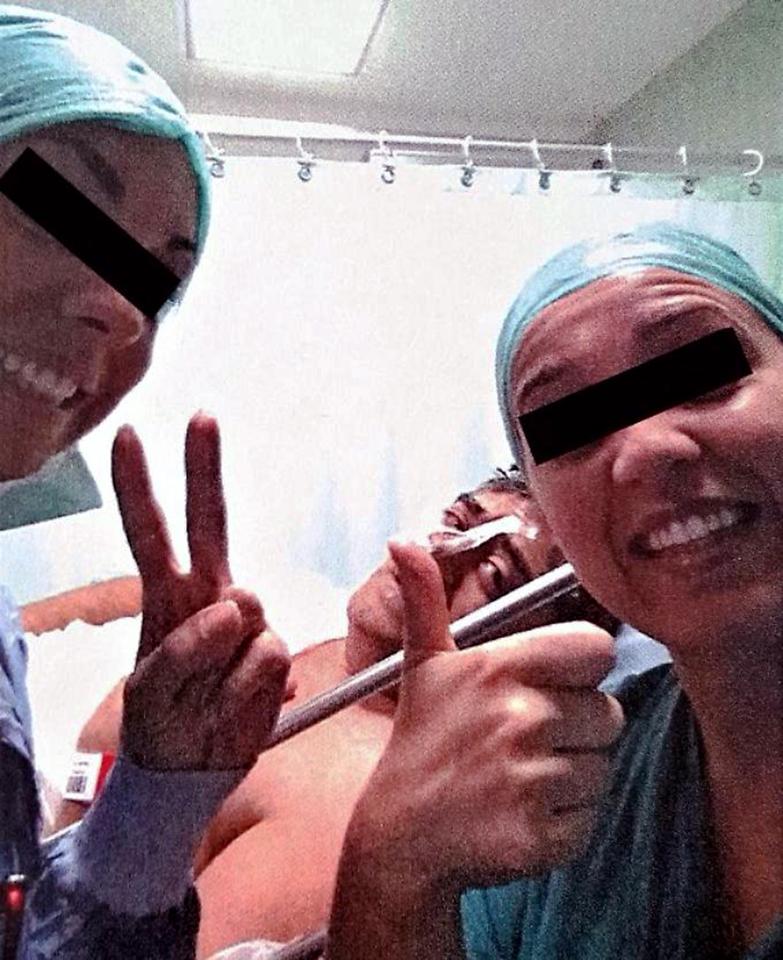  The doctors at the Italian hospital are being investigated after taking this selfie with a patient who later died