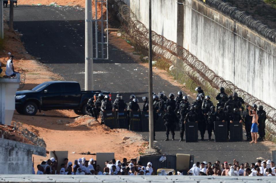  Armed police gathered to storm the prison on Sunday