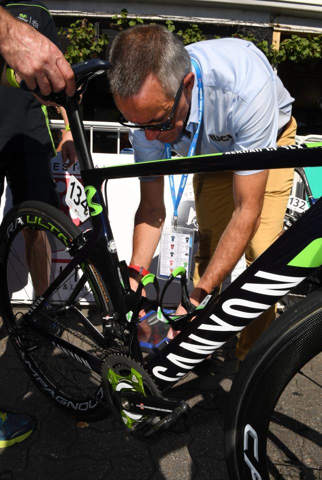  A UCI official checks a bike at the Tour Down Under in 2016